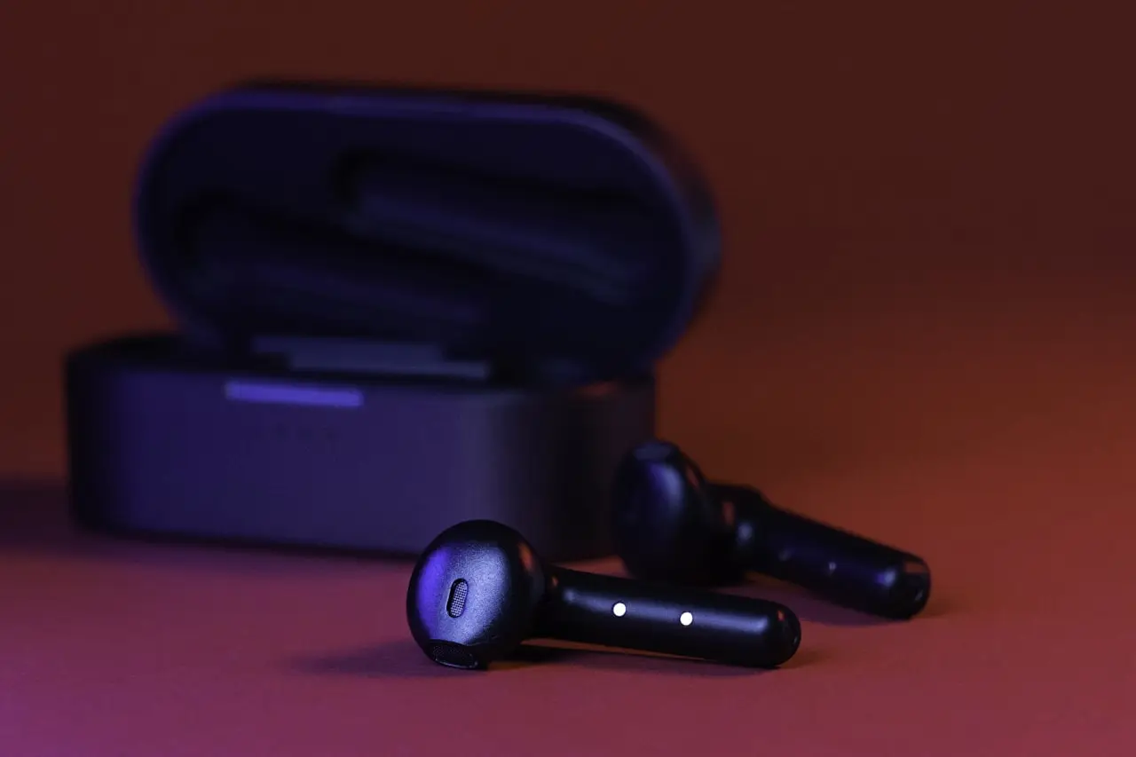 Pair of wireless earbuds on a table