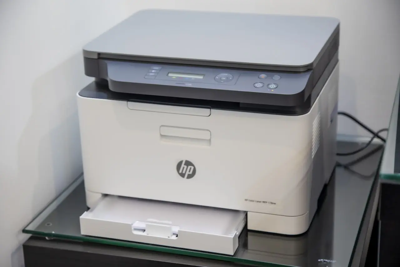 Home office printer next to a computer